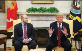  ?? ASSOCIATED PRESS ?? PRESIDENT DONALD TRUMP talks as Joshua Holt, who was recently released from a prison in Venezuela, joins him in the Oval Office of the White House Saturday in Washington.