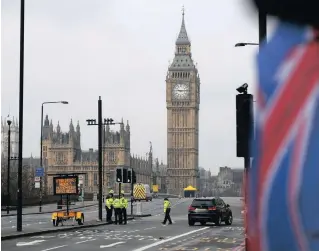  ?? PICTURE: AP ?? Police work on Westminste­r Bridge yesterday at the scene of the terror attack on the Houses of Parliament in London.