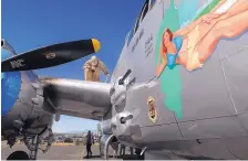  ??  ?? Crew chief Jim Norton checks the fuel level of the vintage B-25 Bomber “Maid in the Shade” at the Santa Fe Municipal Airport on Tuesday, before the plane was used to take military veterans on a special flight.