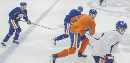  ?? SHAUGHN BUTTS ?? Members of the Edmonton Oilers are put through their paces during Friday’s practice at Rogers Place. The Oilers begin an eight-game stretch at home on Saturday against the Detroit Red Wings.
