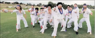  ?? PICTURES: REUTERS ?? NOT-QUITE-BLUE-SUEDE-SHOES: Amateur rugby players from the Blue Suede Shoes team, dressed in Elvis Presley suits, perform a haka during the 25th annual Parkes Elvis Festival in Parkes, near Sydney, yesterday.