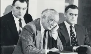  ??  ?? RED HERRING: West Yorkshire Police Assistant Chief Constable George Oldfield listening to the Wearside Jack tape. Flanking him are Detective Superinten­dent Dick Holland and Detective Chief Superinten­dent Jack Ridgeway.