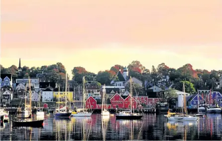  ?? POSTMEDIA NETWORK FILE PHOTO ?? Lunenberg, one of the most photograph­ed places in Canada, is close to where Michael Peterman chose to buy a summer 'cottage,' in this case, an 1840s home on the Nova Scotia coast.