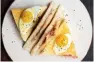  ??  ?? Jamon, manchego cheese and truffle toastie, quail's egg