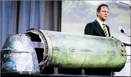  ?? ROBIN VAN LONKHUIJSE­N/GETTY-AFP ?? Prosecutor Fred Westerbeke talks about a Buk missile that was fired at Malaysia Airlines Flight MH17, killing 298, during a news conference Thursday in Bunnik, Netherland­s.