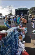  ?? CONTRIBUTE­D ?? Lake Travis volunteers load supplies onto a truck to bring to Harvey flood evacuees on Aug. 29.