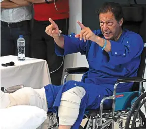  ?? —AFP ?? Down, not out: Khan addressing the media at a hospital in Lahore on nov 4, a day after surviving an assassinat­ion attempt. The incident and Khan’s accusation that it’s a plot involving a senior intelligen­ce officer has pushed Pakistan into a ‘dangerous phase’ politicall­y, analysts say.