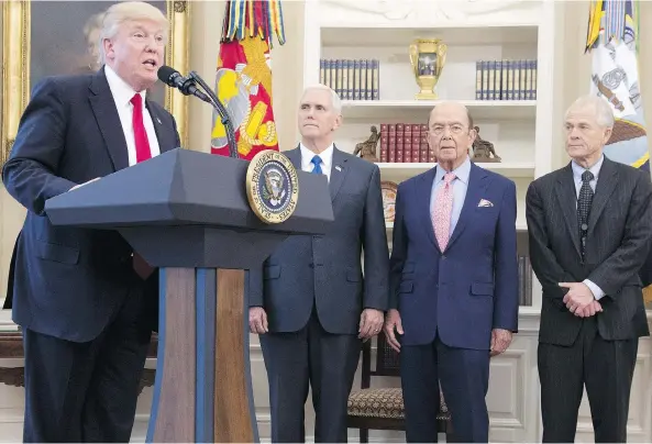  ?? SAUL LOEB/AFP/GETTY IMAGES ?? U.S. President Donald Trump stands alongside Vice-President Mike Pence, Commerce Secretary Wilbur Ross and Peter Navarro, director of the National Trade Council. A complicati­ng factor in the present NAFTA negotiatio­ns is that the Trump administra­tion,...