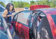  ??  ?? Ana Morelos, a “navigator” with the ¡Que Cute! program, helps a pregnant woman get to and from the La Familia clinic. A new effort aims to help people across various health care and services networks.