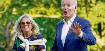  ?? Patrick Semansky / Associated Press ?? First lady Jill Biden, walking on the South Lawn of the White House with President Joe Biden, will appear on the cover of the August issue of Vogue magazine.