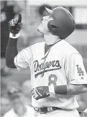  ?? JOHN AMIS/AP ?? Manny Machado, who had four RBIs to lead the Dodgers into the NLCS, celebrates his seventh-inning home run.