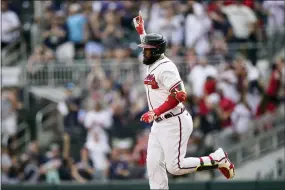  ?? BRYNN ANDERSON — THE ASSOCIATED PRESS ?? Atlanta Braves’ Marcell Ozuna (20) celebrates after hitting a two-run home run in the eighth inning of a baseball game against the San Diego Padres, Saturday, May 14, 2022, in Atlanta.