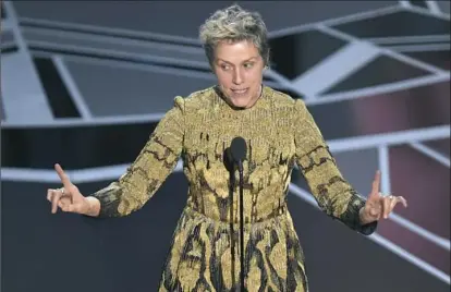  ?? Chris Pizzello/Invision/AP ?? Monessen High School graduate Frances McDormand accepts the award for best performanc­e by an actress in a leading role for “Three Billboards Outside Ebbing, Missouri” at the Oscars on Sunday.