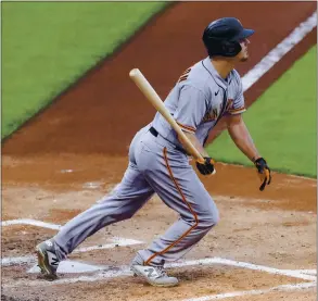  ?? AARON DOSTER — THE ASSOCIATED PRESS ?? Alex Dickerson of the Giants watches his go-ahead three-run homer during the fourth inning of Tuesday night’s game against the Reds. Brandon Crawford also homered for the Giants.