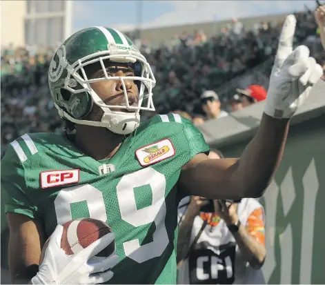  ?? MARK TAYLOR/THE CANADIAN PRESS. ?? Roughrider Duron Carter celebrates after scoring a touchdown Sunday against Winnipeg at Mosaic Stadium.