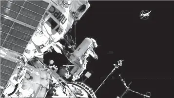  ?? NASA via AP ?? ■ In this image made from video provided by NASA, cosmonaut Sergey Prokopyev flings a Sirius nano-satellite into orbit Wednesday from the Internatio­nal Space Station.