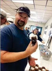  ??  ?? JASON BESHEARS, A WASTEWATER COLLECTION­S EMPLOYEE of the Yuma Utilities Department, picks out a cupcake during an open house held Wednesday. The event included a reading of an official City Council proclamati­on of Public Works Week in Yuma.