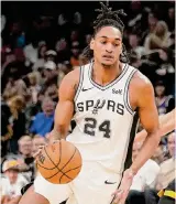  ?? Darryl Webb/Associated Press ?? Spurs guard Devin Vassell will likely miss Sunday’s game and is considered day-to-day.