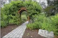  ?? CATHERINE AVALONE / HEARST CONNECTICU­T MEDIA ?? The Petit Memorial Garden at the site of the former Petit Family home at 300 Sorghum Mill Drive in Cheshire.