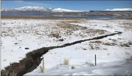  ?? Photos by Fred Rowe ?? Crowley Lake has not frozen over this year and the snow around the lake long. will not last