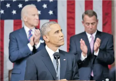  ?? MANDEL NGAN/The Associated Press U.S. President Barack Obama arrives to deliver his State of the Union address to a joint session of Congress on Capitol
Hill Tuesday night in Washington. Applauding are Vice-President Joe Biden, left, and House Speaker Jo ??