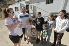  ?? Dan Watson/The Signal ?? Carrie, left, and Justin Powers and their seven children have been residents of Cali Lake RV Resort since July.