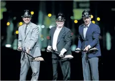  ?? JOHN LOCHER/ THE ASSOCIATED PRESS ?? Oakland Raiders owner Mark Davis, centre, poses for photograph­s beside Nevada Gov. Brian Sandoval, left, and NFL Commission­er Roger Godell during a ceremonial groundbrea­king for the Raiders’ stadium Monday, in Las Vegas. After years of planning, dealing and getting millions in public financing approved, the team broke ground on a 65,000- seat domed stadium in Las Vegas, across the freeway from the city’s world- famous casinos.