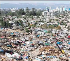  ?? ZACHARIAS ABUBEKER/AFP ?? A photo taken on Sunday shows a view of Addis Ababa from the main landfill on the outskirts of the city, after a landslide at the dump left at least 46 people dead and dozens more hurt.