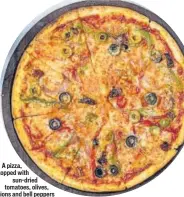  ??  ?? A pizza, topped with sun-dried tomatoes, olives, onions and bell peppers