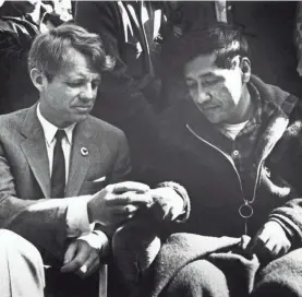 ?? BETTMANN ARCHIVE ?? Robert Kennedy, left, breaks bread with union leader Cesar Chavez as he ends a 25-day fast in a strike against grape growers.