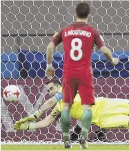  ?? APPHOTO ?? BRAVO! Chile goalkeeper Claudio Bravo stops a penalty kick off the foot of Portugal’s Joao Moutinho during yesterday’s Confederat­ions Cup semifinal in Kazan, Russia. Bravo made three penalty saves in Chile’s shootout victory, and the team will face the...