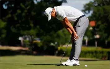  ?? Ronald Martinez/Getty Images ?? Collin Morikawa reacts after missing his putt for par on the first playoff hole at Colonial.