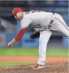  ?? VASQUEZ / USA TODAY SPORTS GARY A. ?? Justin Wilson pitched in five games last season for the Reds, logging a 2.45 earned run average, before undergoing surgery June 3.