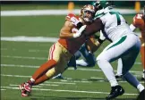  ?? ADAM HUNGER — THE ASSOCIATED PRESS ?? Defensive end Nick Bosa, left, suffered a torn left ACL during the 49ers’ game Sunday against the New York Jets on the suspect new turf at MetLife Stadium.