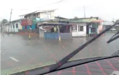  ??  ?? The submerged road at Kampung Senadin Jaya.