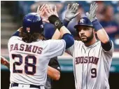  ?? Ron Schwane / Associated Press ?? Marwin Gonzalez is greeted by Colby Rasmus after striking the big blow Tuesday night — a three-run homer in the second inning.
