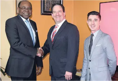  ??  ?? In this November 14, 2016 photo, Minister of Tourism Edmund Bartlett (left) is visited by Airbnb regional executives, Shawn Sullivan (centre) and Carlos Muñoz to discuss plans for a partnershi­p with Jamaica.