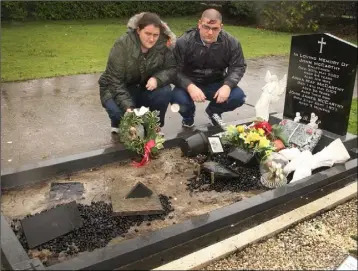  ??  ?? Tanya Kenny pictured with her husband, Darren Kenny at Tanya’s family grave in Ballyought­er.