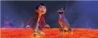  ?? PIXAR ?? Miguel, voiced by Anthony Gonzalez, left, and his dog Dante in a scene from Coco, in theatres Nov. 22.