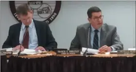  ?? EVAN BRANDT — DIGITAL FIRST MEDIA ?? Upper Pottsgrove police Chief Francis Wheatley, right, is also currently serving as the township’s acting township manager. At left is board of commission­ers Chairman Trace Slinkerd.