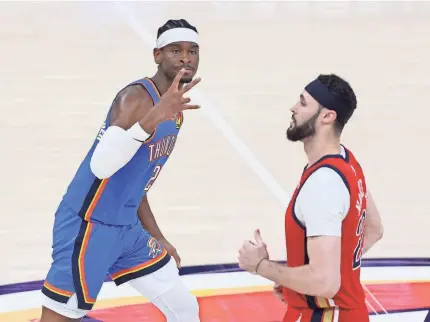  ?? BRYAN TERRY/THE OKLAHOMAN ?? Oklahoma City guard Shai Gilgeous-Alexander (2) celebrates beside New Orleans forward Larry Nance Jr. (22) after making a 3-pointer during Game 2 of their playoff series in Oklahoma City on Wednesday.