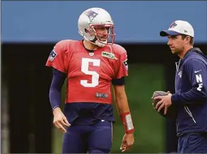  ?? Steven Senne / Associated Press ?? Patriots quarterbac­k Brian Hoyer (5) warms up during a recent practice.