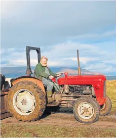  ?? ?? STALWART: Lawrence Macewen with his beloved tractor.