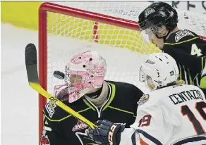  ?? LARRY WONG ?? Edmonton Oil Kings goalie Todd Scott looks for the puck during Sunday’s game against the Kamloops Blazers at Rogers Place.