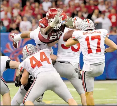  ?? Democrat-Gazette file photo ?? Arkansas’ Colton Miles-Nash blocks a punt by Ohio State’s Ben Buchanan with less than two minutes remaining in the 2011 Sugar Bowl in New Orleans. The Razorbacks did not seize an opportunit­y to return the block for a winning touchdown and took over at...