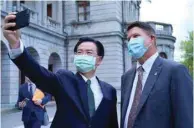  ??  ?? This handout picture taken and released by Taiwan’s ministry of foreign affairs yesterday shows Taiwan’s Foreign Minister Joseph Wu taking a picture with the US’s Keith Krach at the Taipei Guest House in Taipei.