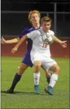  ?? PETE BANNAN — DIGITAL FIRST MEDIA ?? Haverford’s Will Gardner fends off an Upper Darby defender. Gardner scored nine goals to lead the Fords to the District 1 Class 4A tournament.