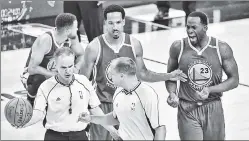  ?? Getty Images ?? BEG TO DIFFER: Draymond Green (right) and Shaun Livingston argue with officials during Friday’s Game 4 in Cleveland.