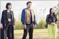  ?? Jasin Boland / Associated Press ?? This image released by Marvel Studios shows, from left, Meng’er Zhang, Simu Liu and Awkwafina in a scene from “Shang-Chi and the Legend of the Ten Rings.”