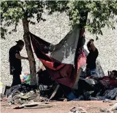  ?? PEDRONCELL­I/AP FILE RICH ?? A homeless encampment is shaded by a tree in Sacramento last year. Judges have been on the front lines of policy related to homeless people as friction mounts over visible tent encampment­s amid a severe shortage of affordable housing.